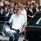 Prince william showing his son to public